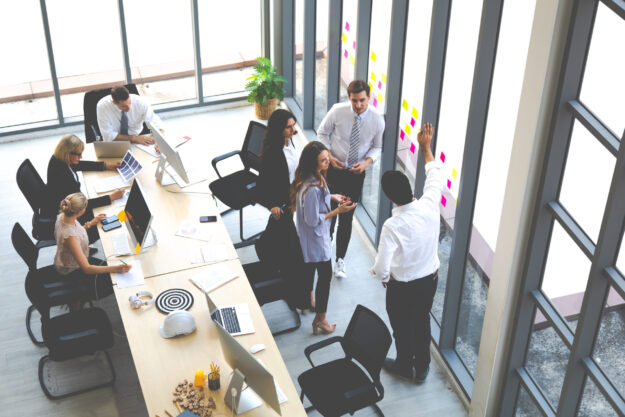 Top view group of multiethnic business man and woman busy working and meeting in conference room. people work in modern office. Professional business team success.